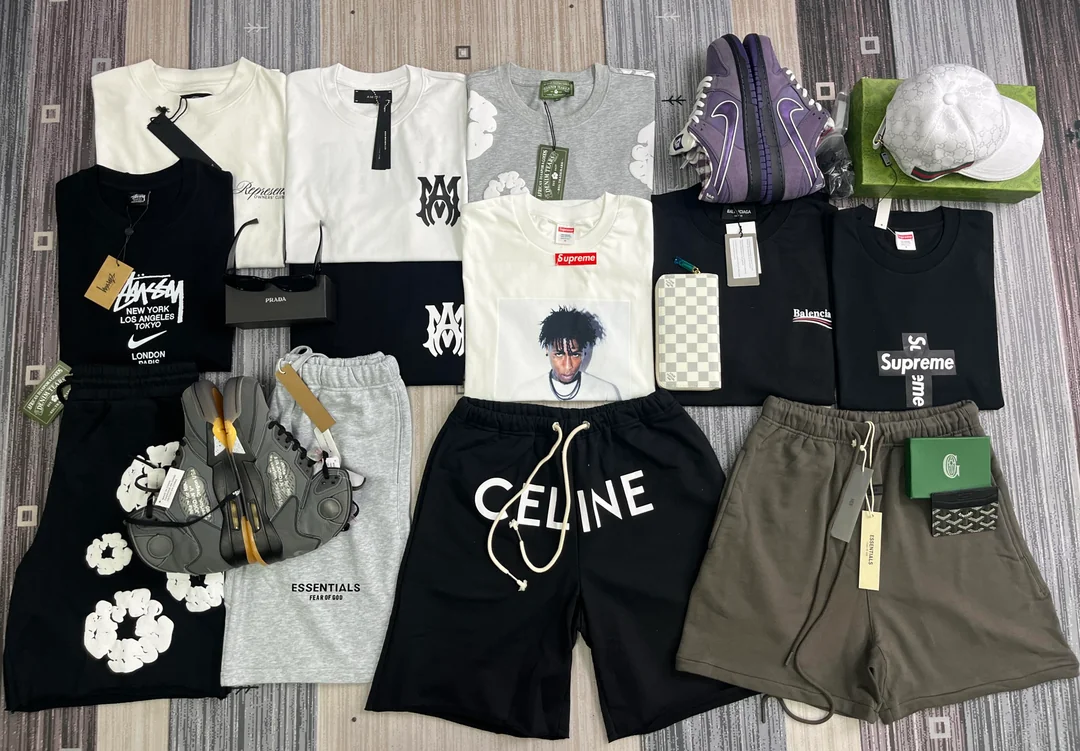 Clothing, caps, wallets and shoes arranged from the Czech haul