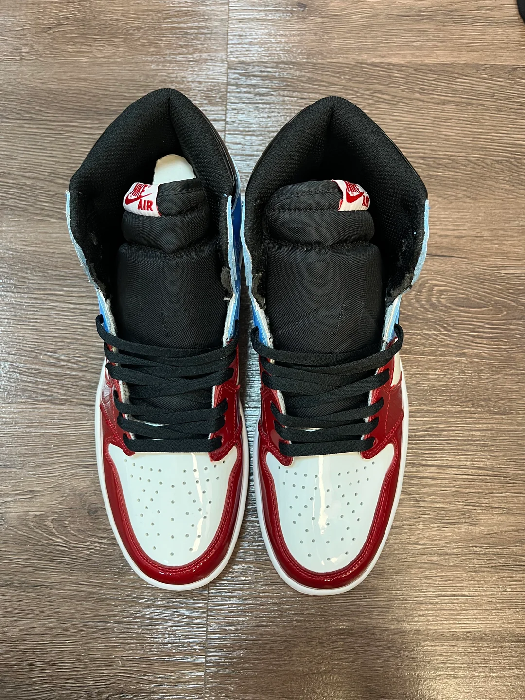 Close front view of the red and blue high-top sneakers from the haul