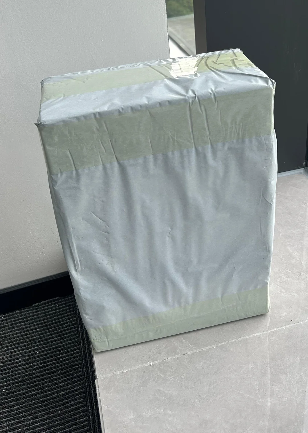 Wrapped 2.3 kilogram parcel photographed after delivery in Germany