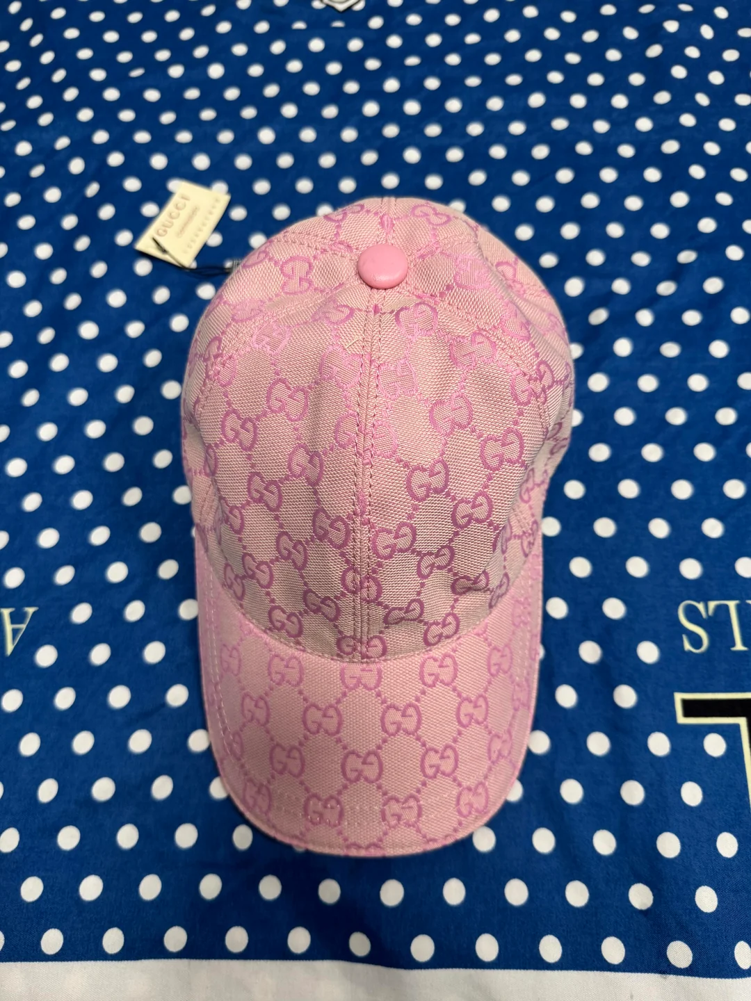 Close front view of the pink monogram cap from the UK haul