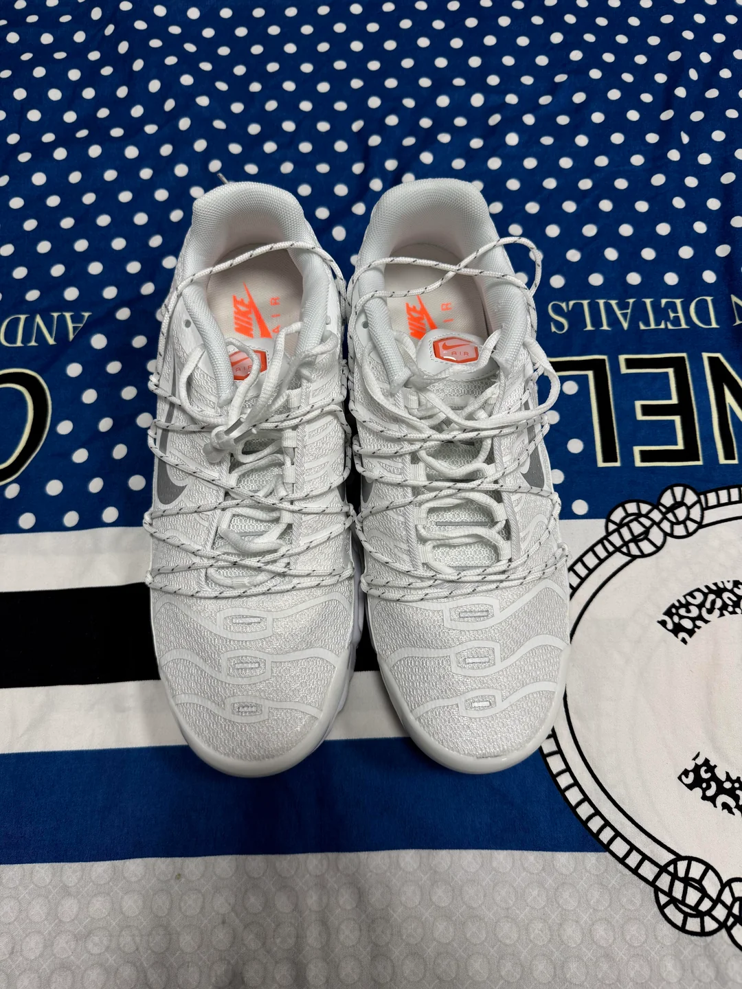 White Nike-style sneakers photographed from above in the UK haul
